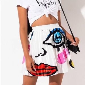 Picasso face pleated mini skirt.